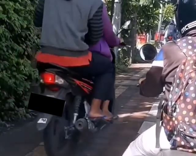 Some Bali Locals Continue To Ride Motorbikes On Sidewalks Risking The Lives Of Pedestrians