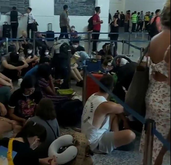 Video footage showed the travellers squashed together at the terminals, with many forced to make themselves comfortable on the floor