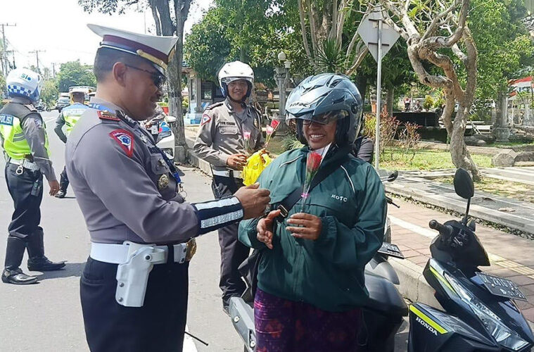 bali police hand out flowers and chocolates