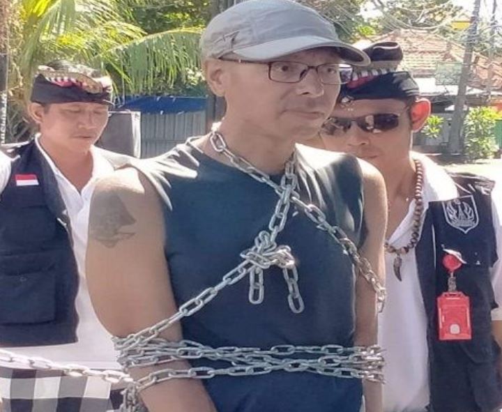 man chained on nyepi