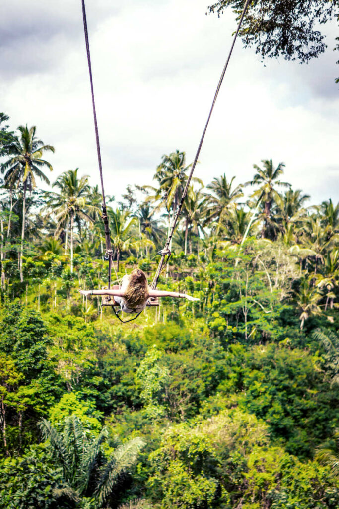 Bali tourist on swing