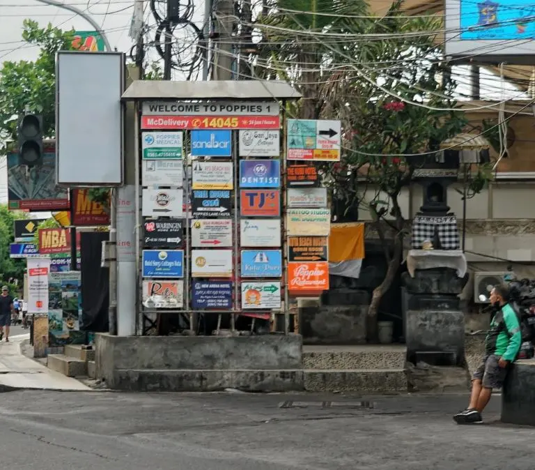 bali grab driver in street wearing mask