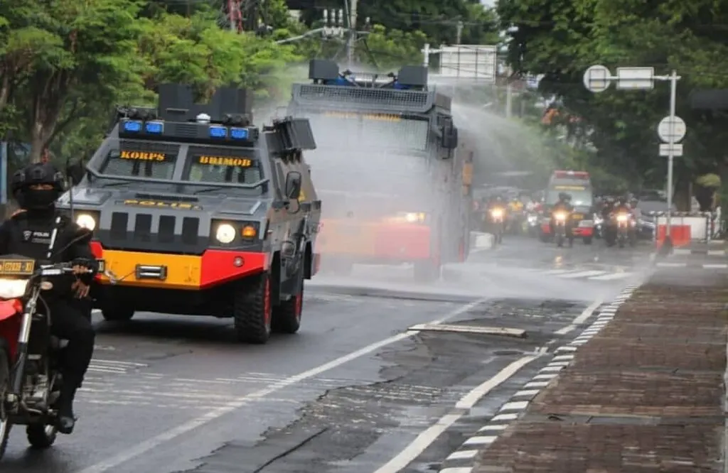 police sanitize streets in bali