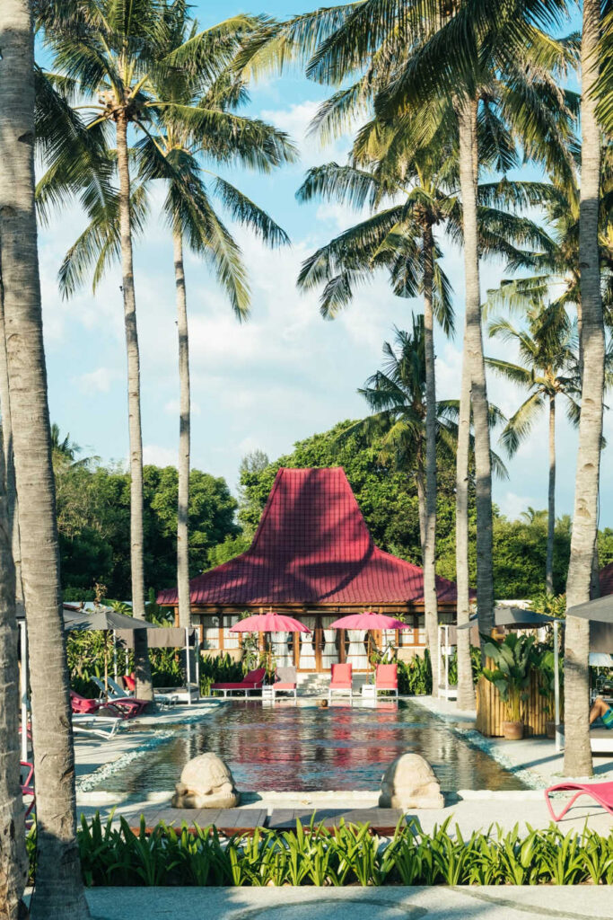 Bali hotel pool with palm trees