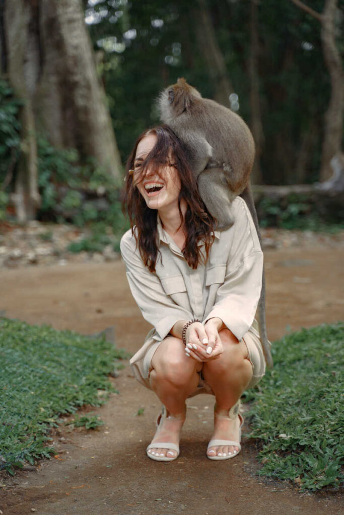 Woman tourist happy at monkey forest