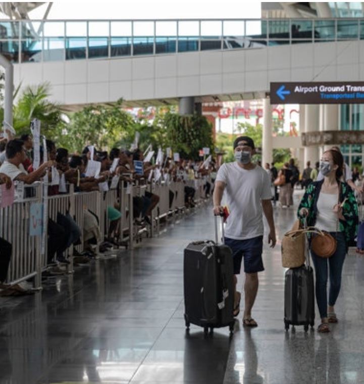 Bali airport tourists mask