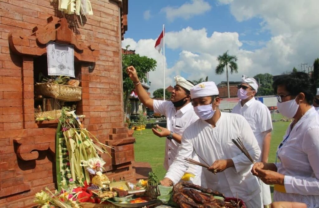 Bali locals in masks at temple