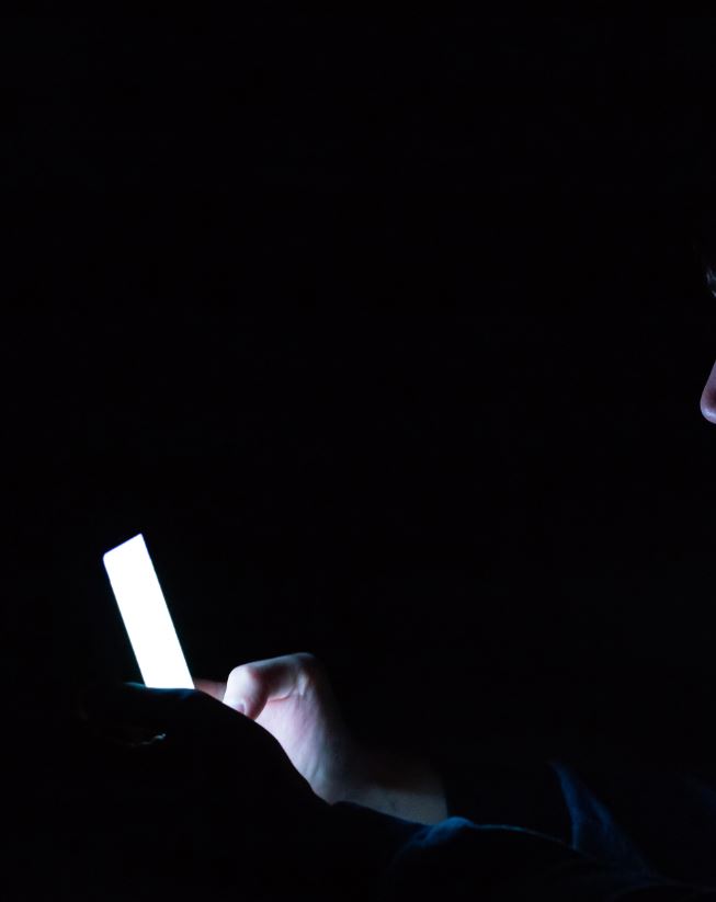 watching phone in dark