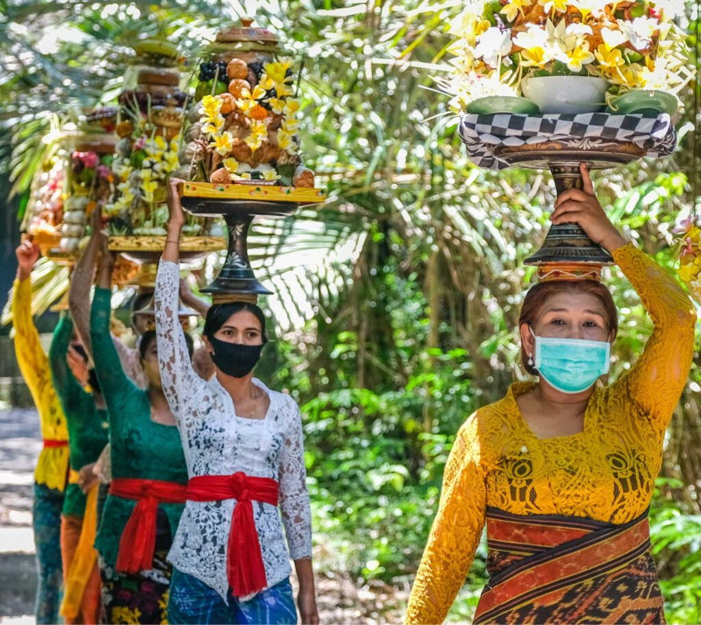 Bali locals in masks