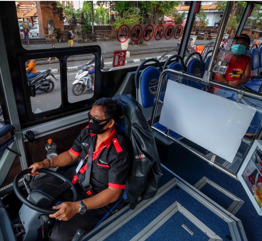 Bali locals wearing masks on bus