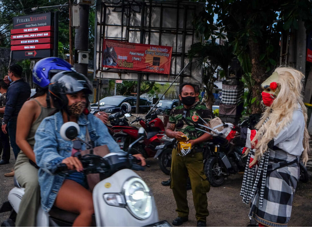 Bali locals with mask and culture