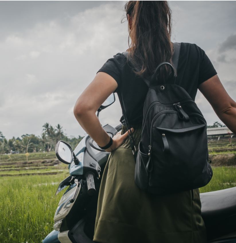 woman with scooter in bali