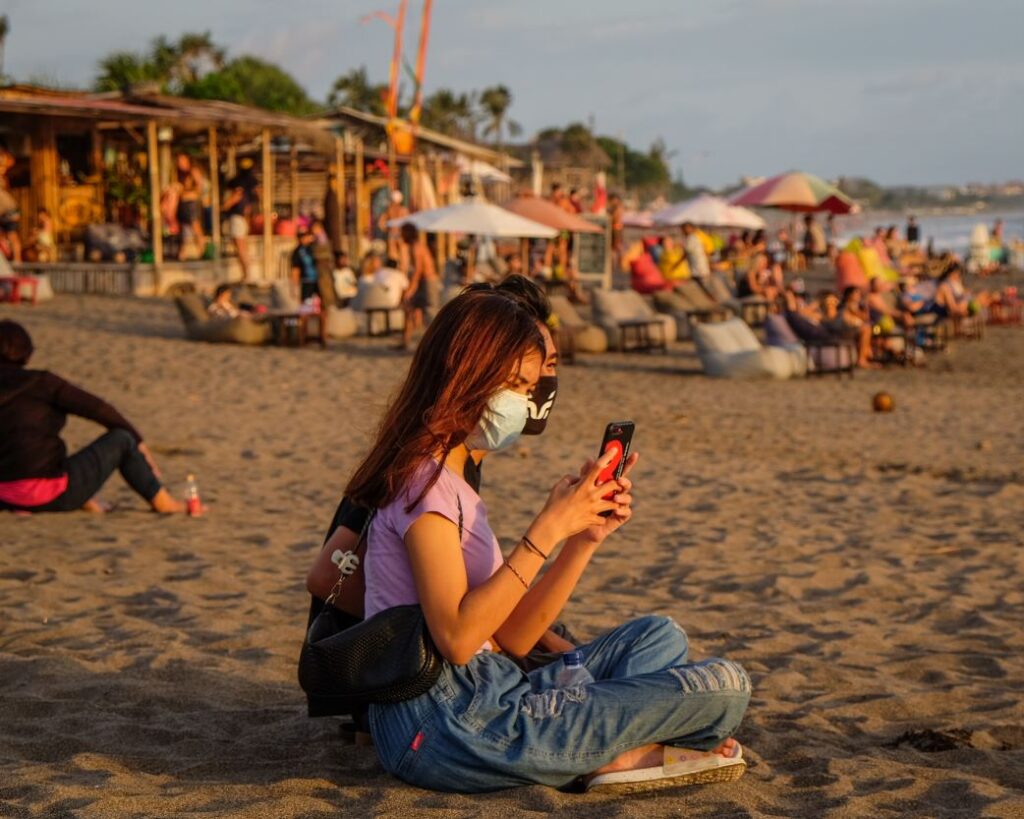 bali domestic tourists masks on beach