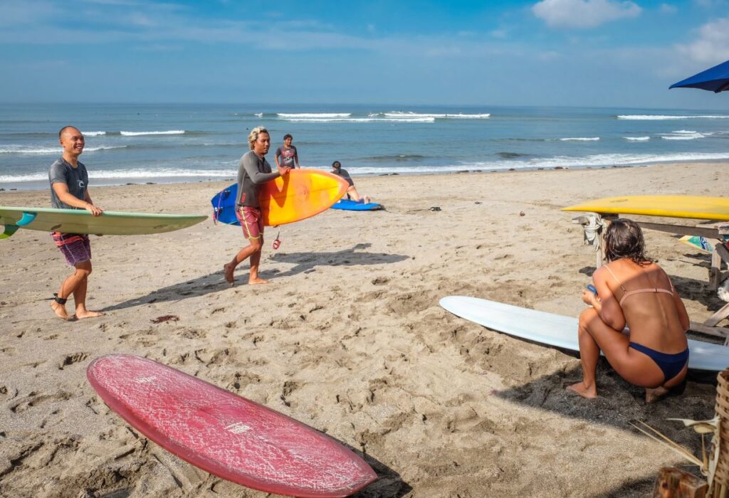 Bali tourists at beach surf