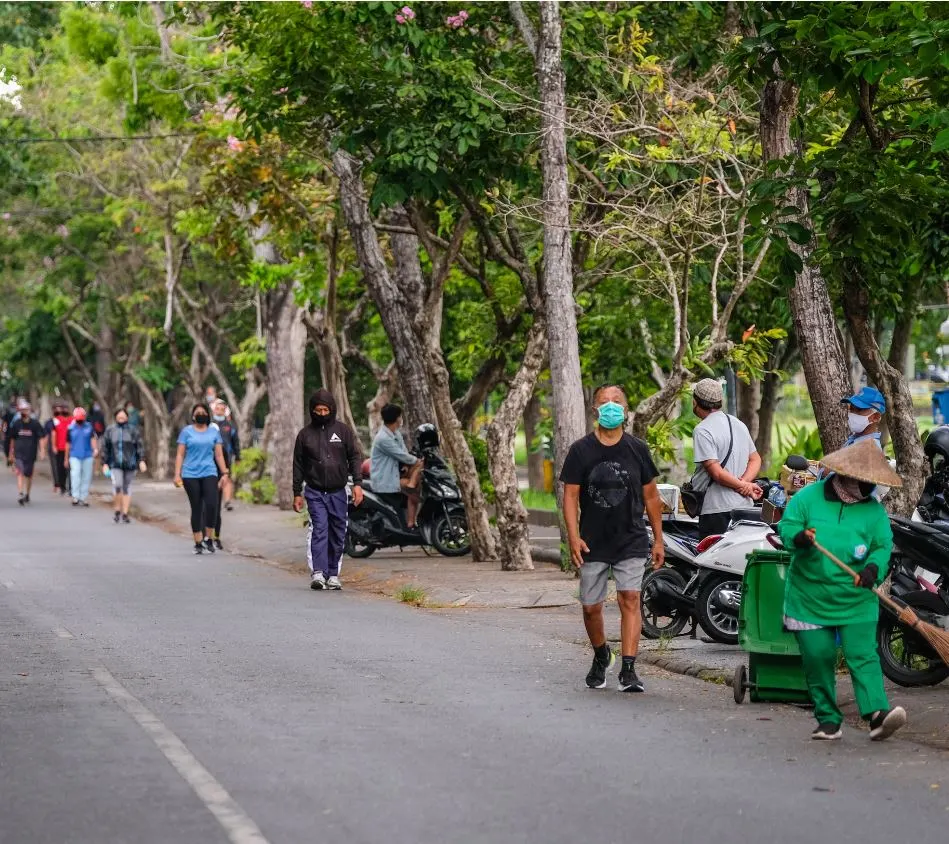 bali resident walking with masks on