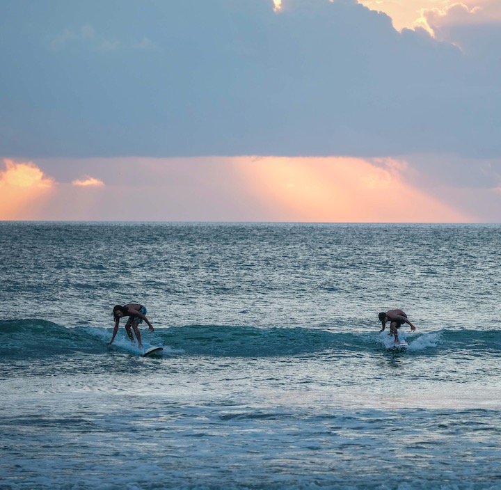 Bali surfers sunset