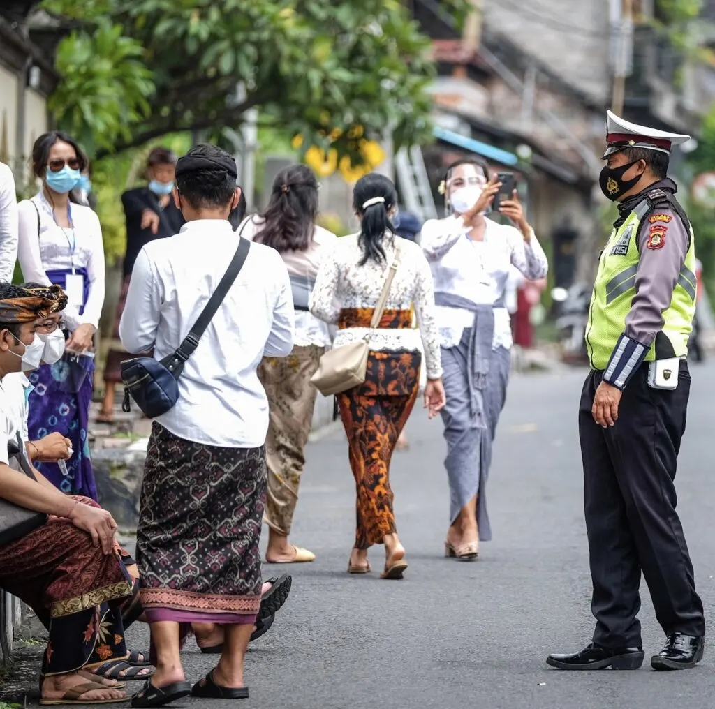 Bali masks police officer locals