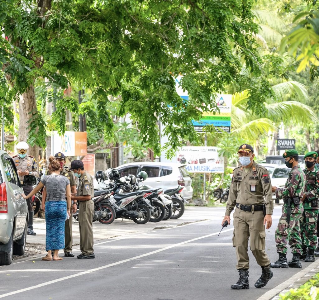 Bali police masks fines