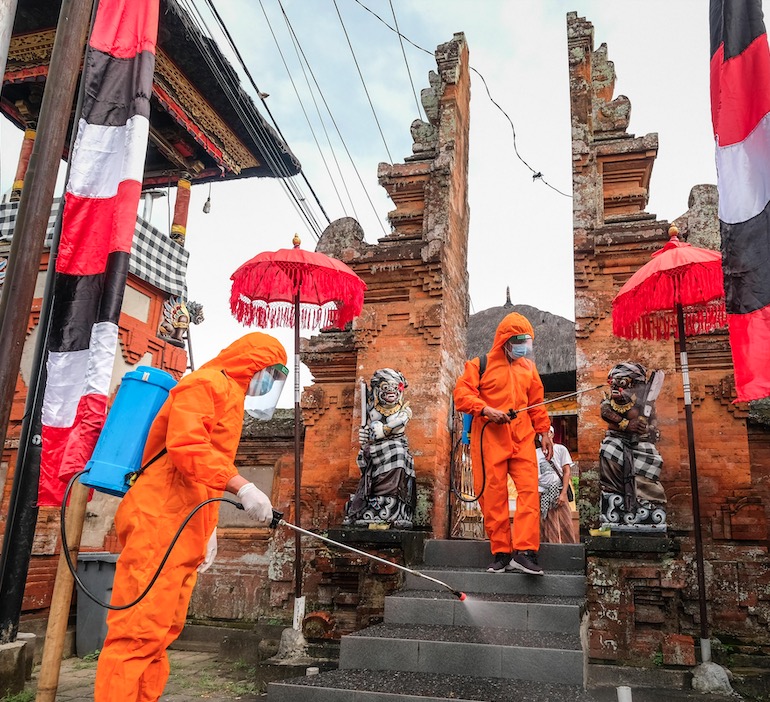 covid19 task force sanitizing Bali temple