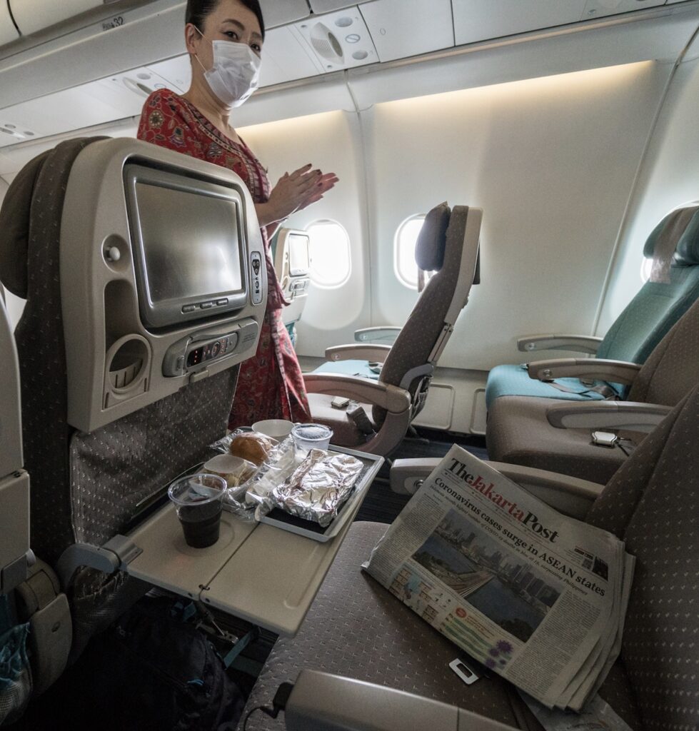 flight attendant in mask Bali