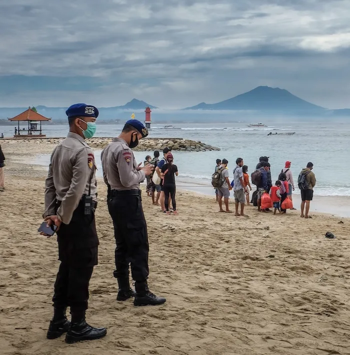 police at beach masks