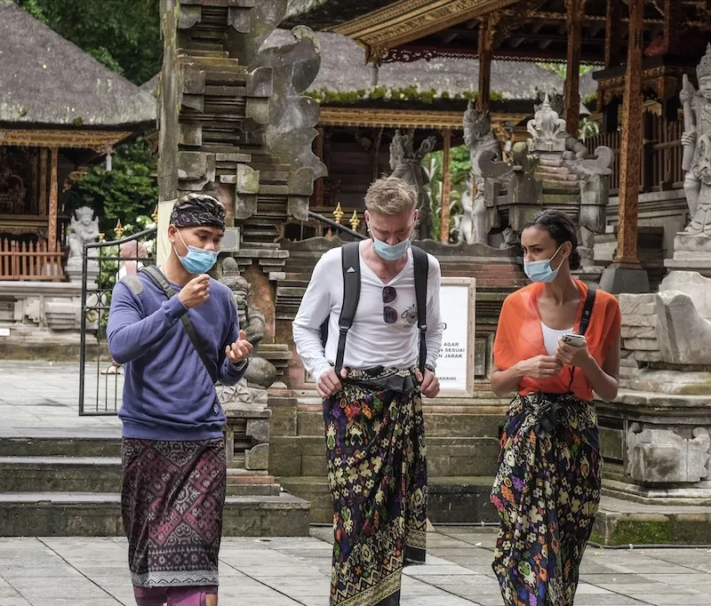 tourists at temple with tourguide