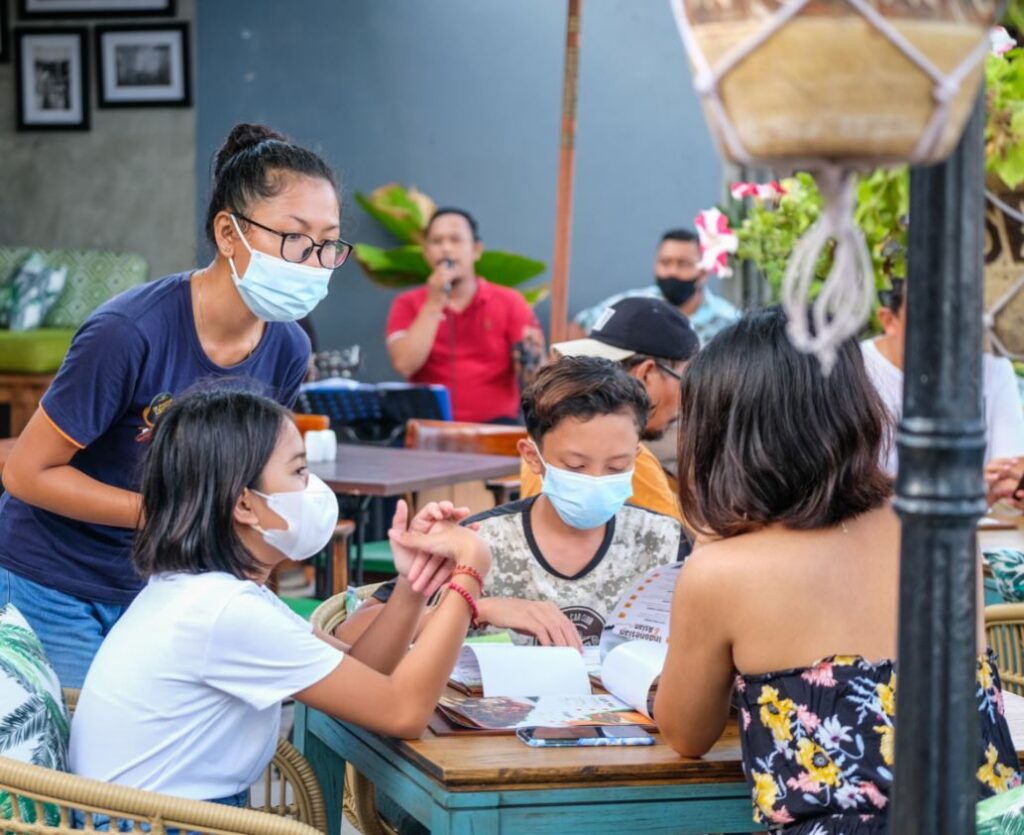 Bali restaurant servers in masks