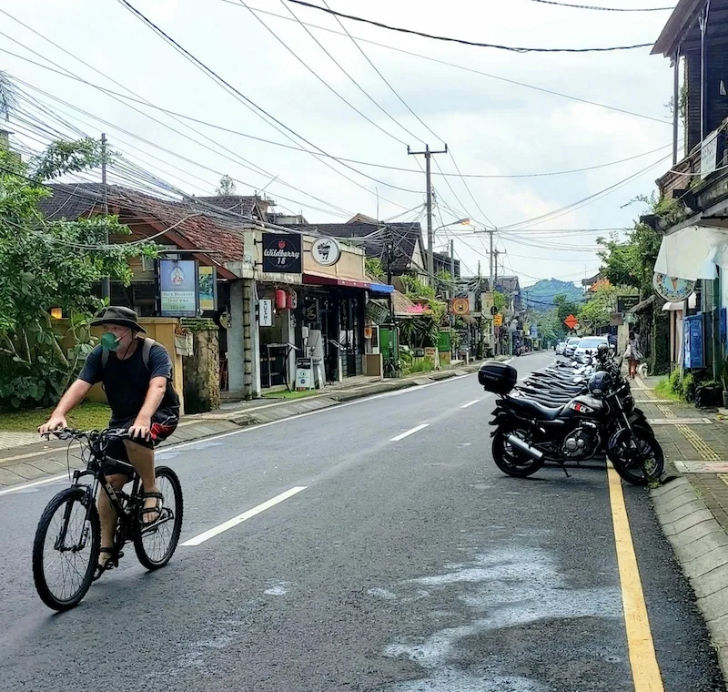 mask tourist on bike in Ubud