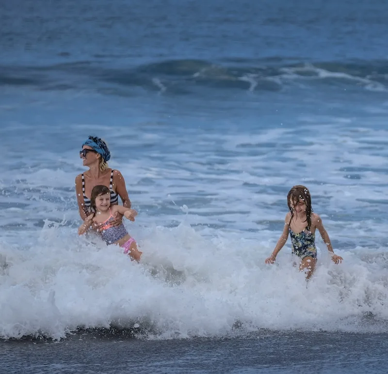 tourist family having fun at beach