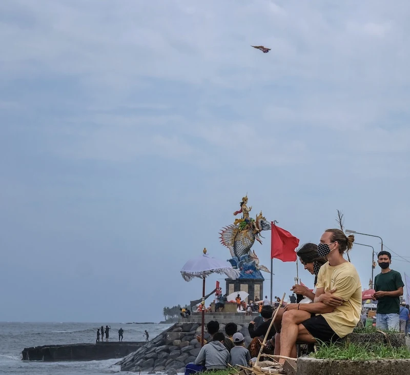 tourists in Bali mask
