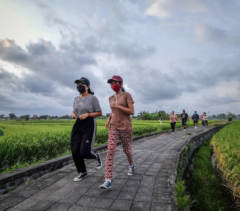 Bali locals jogging wearing face masks