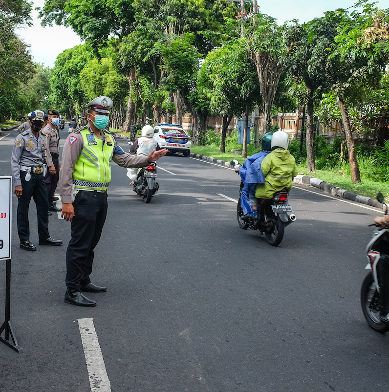Bali police stopping motorbikes