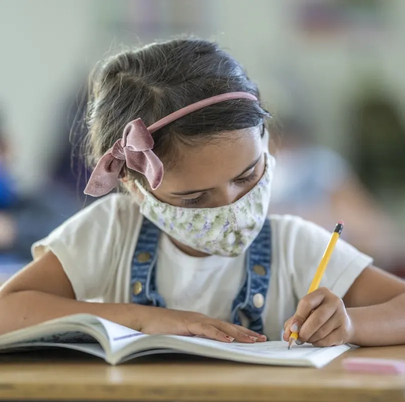 Girl in classroom during COVID