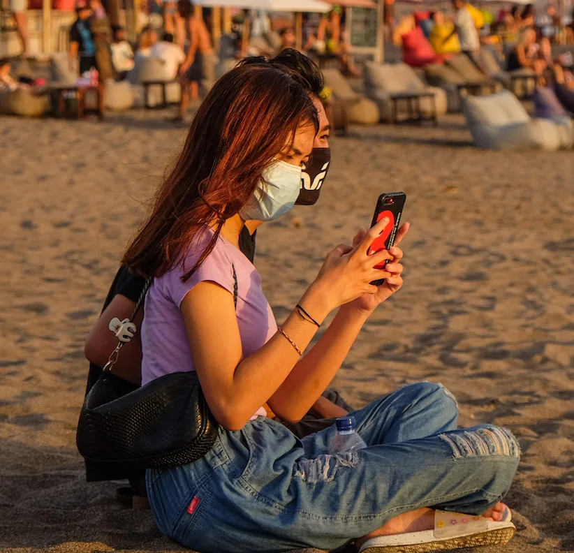 Using phone at the beach