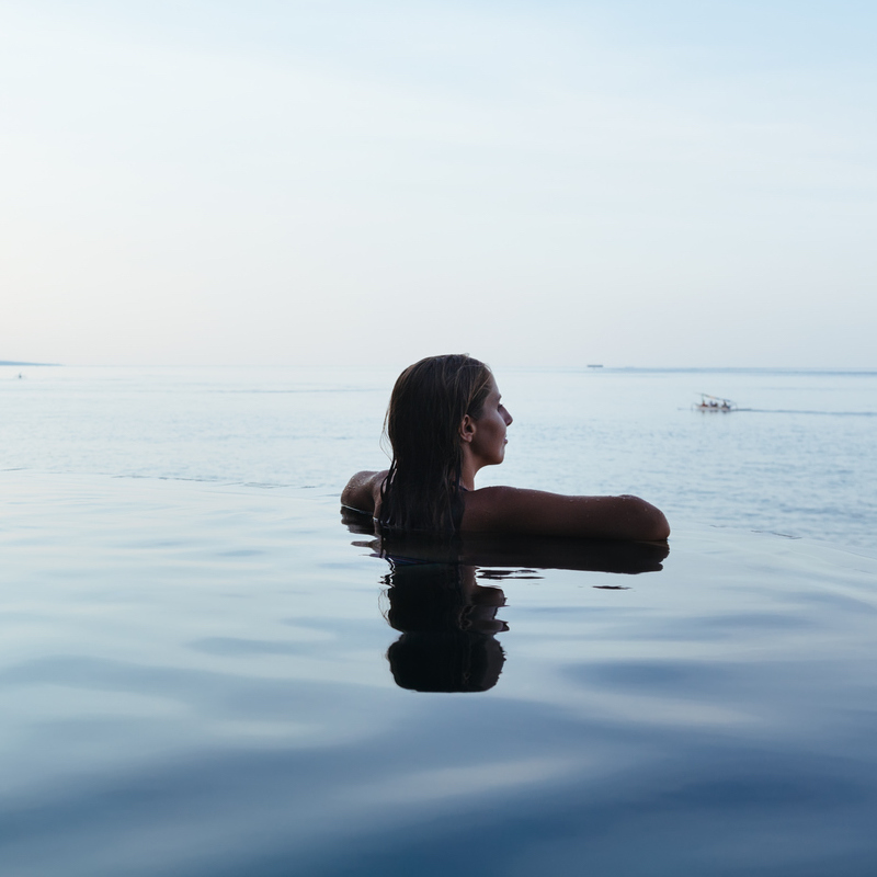 Woman in Bali villa pool
