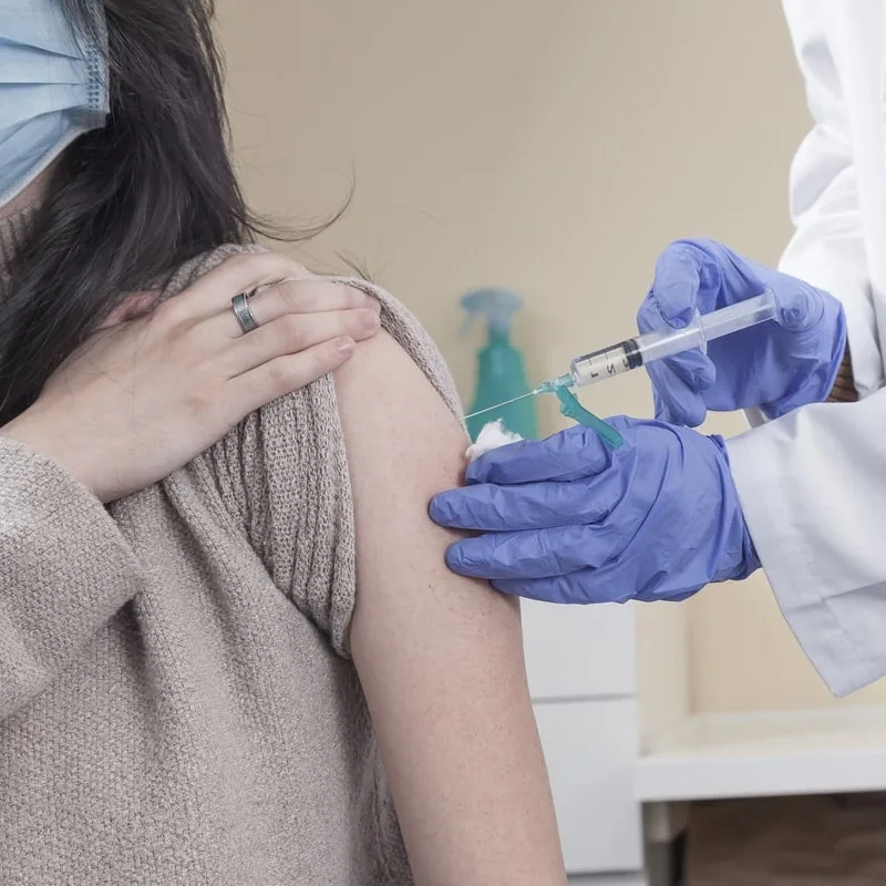 Woman receiving vaccine