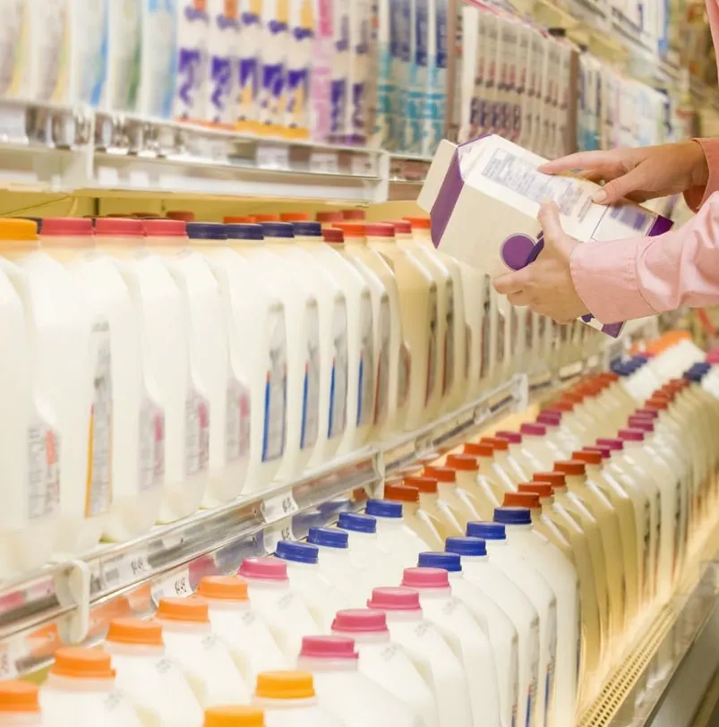 Woman buying milk