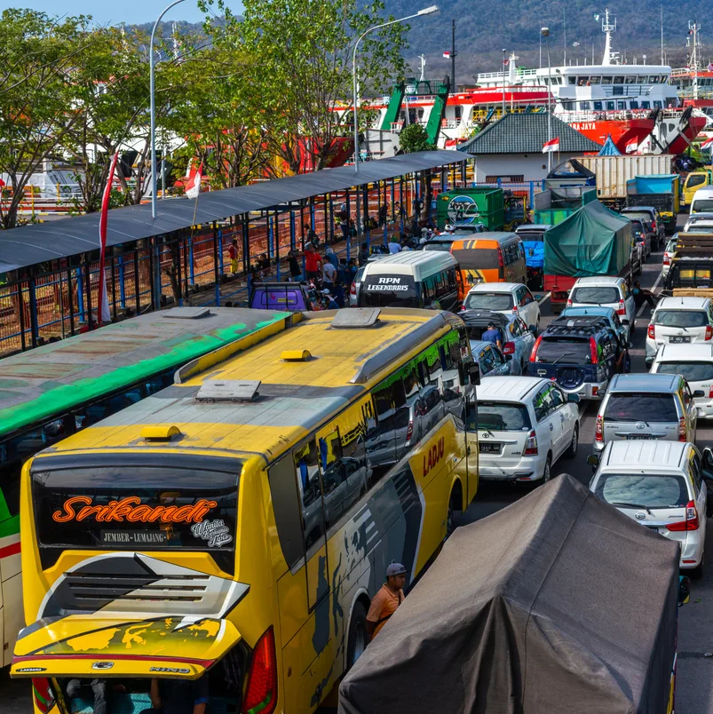 Bali, Indonesia - August 11, 2018: Bali  view showing Gilimanuk Port with passenger transport vehicles , buses and cars