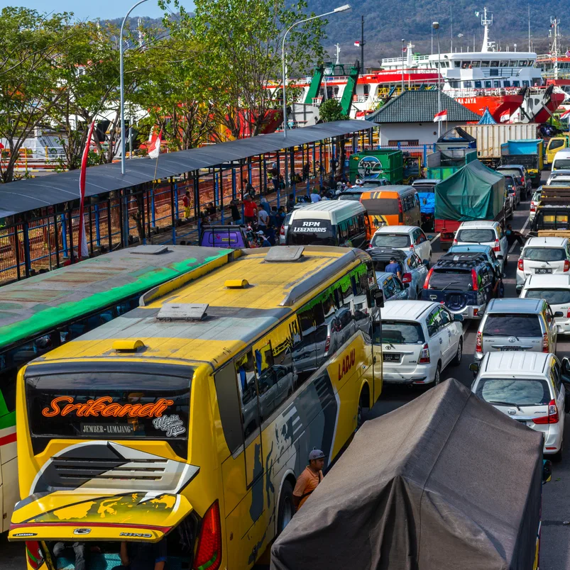 Bali, Indonesia - August 11, 2018: Bali view showing Gilimanuk Port with passenger transport vehicles , buses and cars