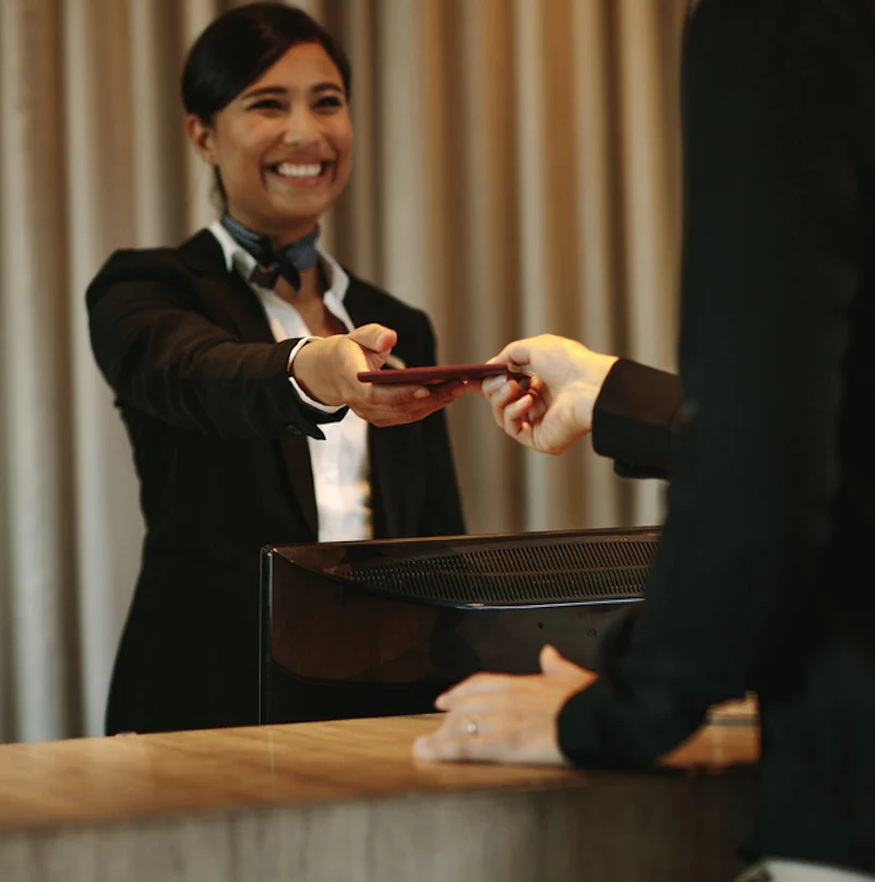 Concierge returning the documents to hotel guest