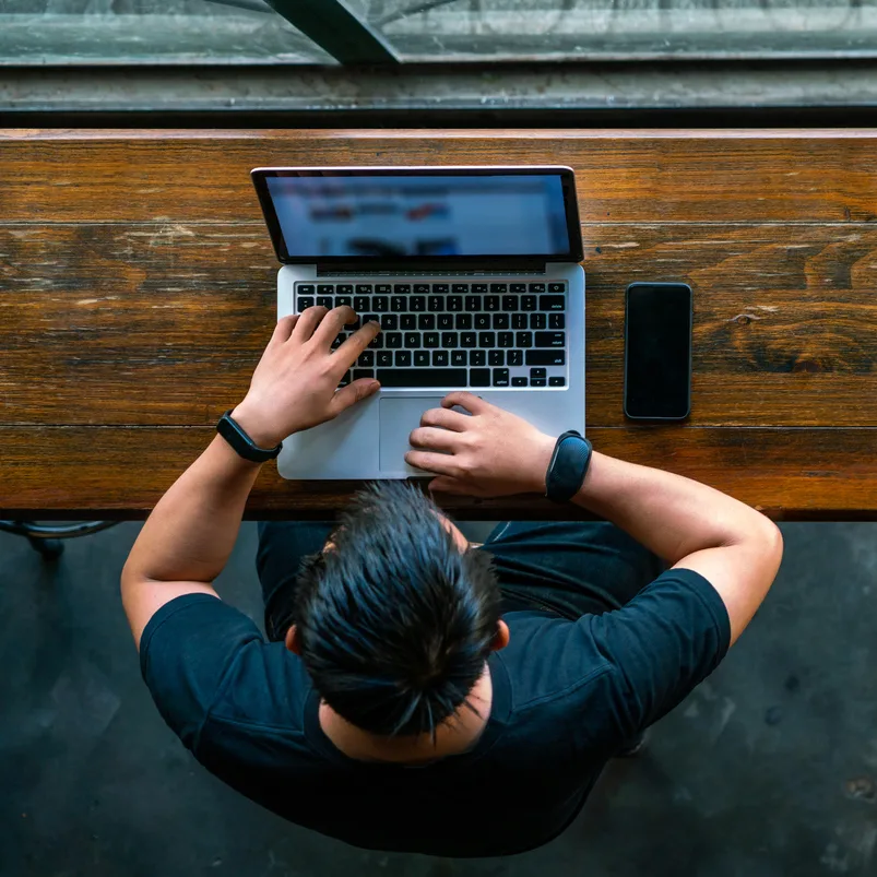 Young Asian man using laptop