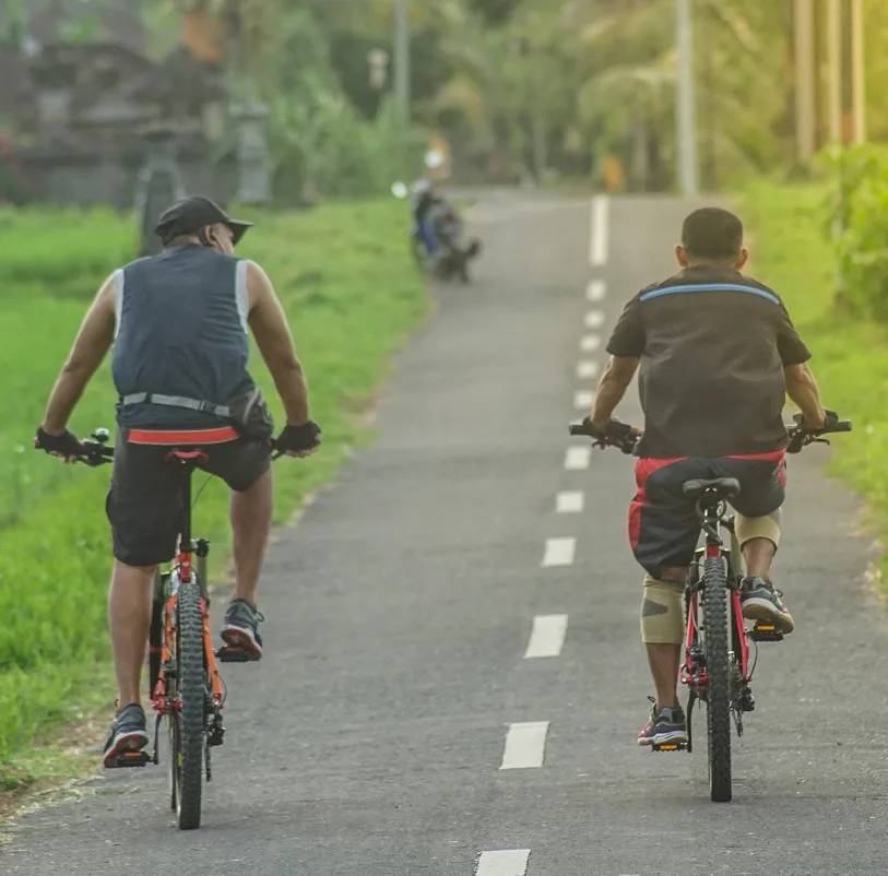 men biking bali