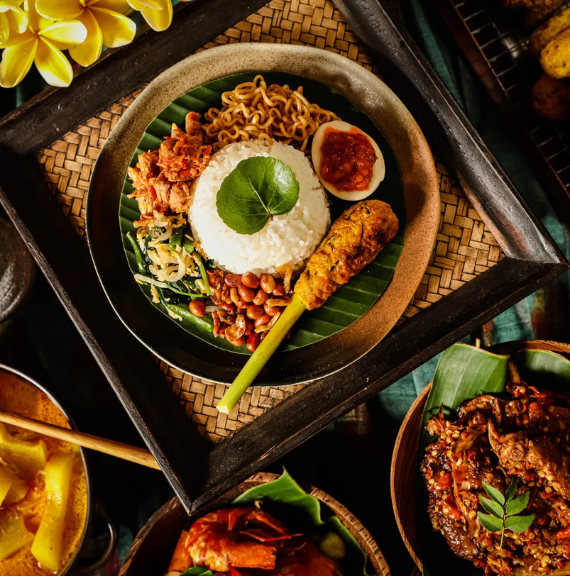 Nasi Campur Bali, the Balinese Meal of Steamed Rice with Ayam Sisit, Jukut Urap, Sate Lilit, Kacang Teri, Sambal Plecing Egg and Mie Goreng