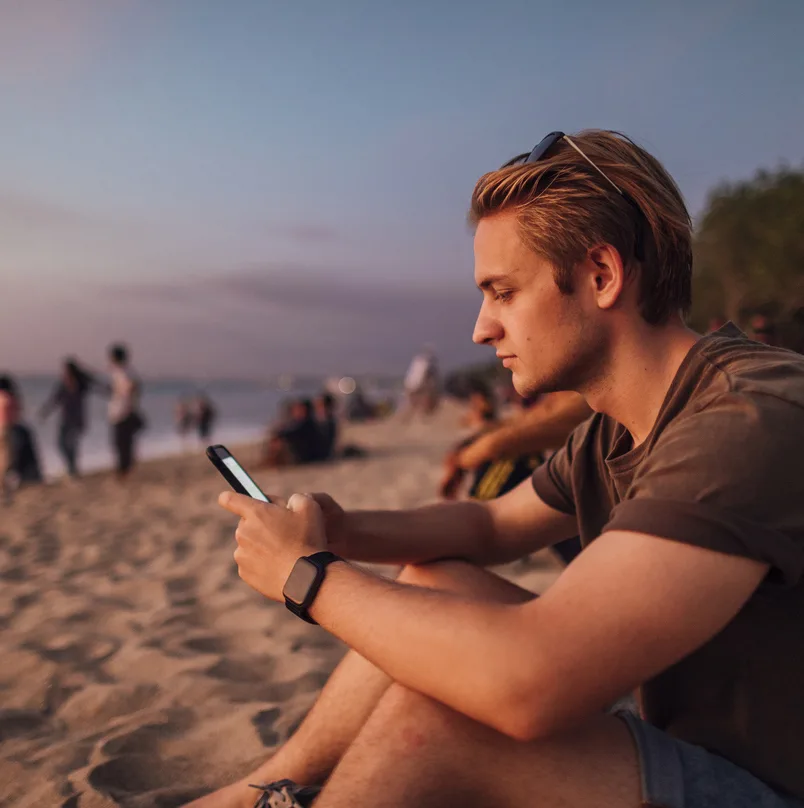 man phone bali beach