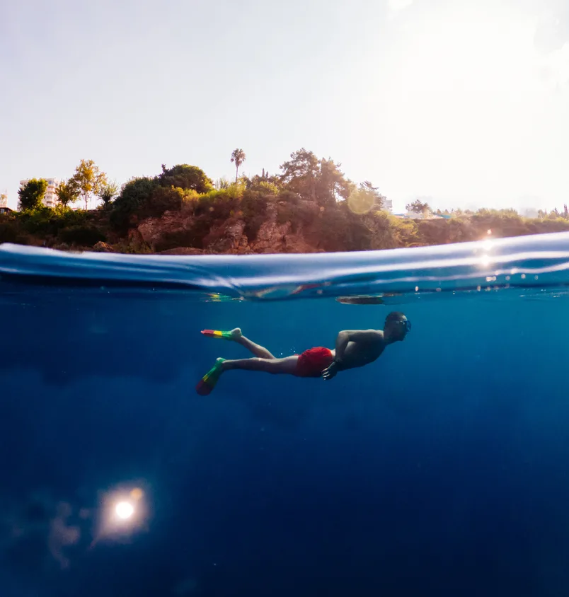 man underwater swimming bali