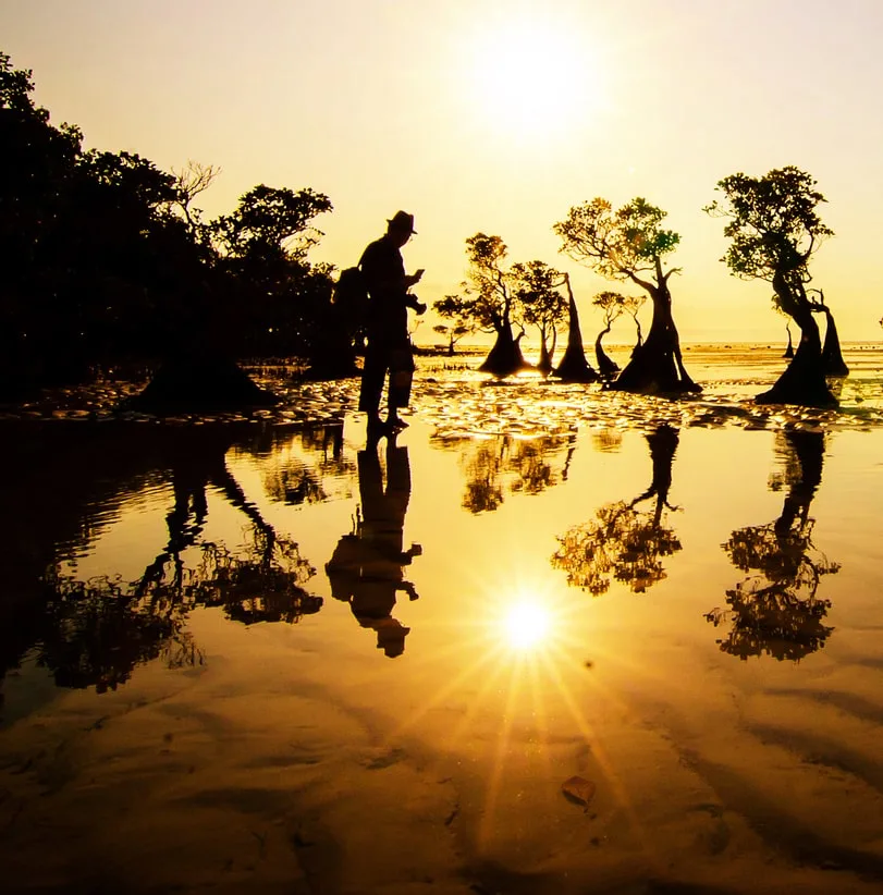 man sunset reflection