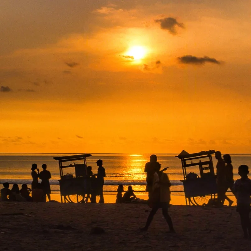 kuta beach sunset people