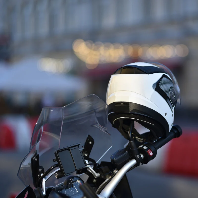 Bike-Helmet-Hanging-On-Handle-Bars-Of-Scooter-Parked-On-A-Street