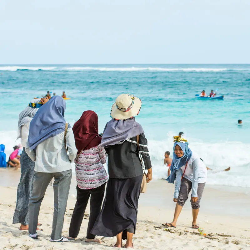 Domestic-Tourists-Take-Photo-On-Bali-Beach