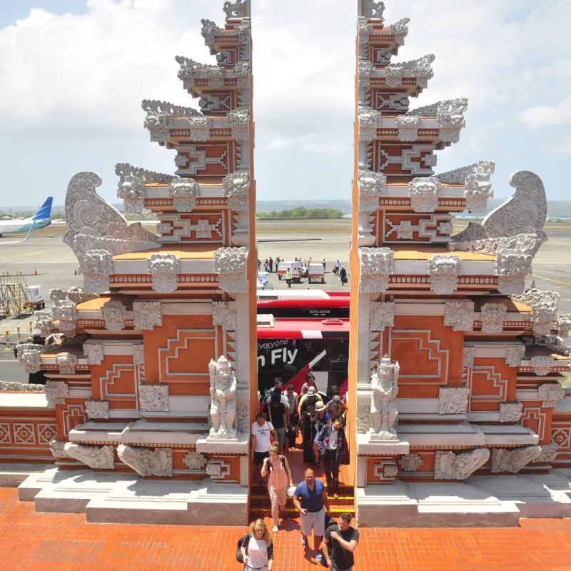 International-Arrivals-Walking-Traditional-Gate-at-Bali-Airport